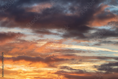 Fototapeta Naklejka Na Ścianę i Meble -  Multi-colored dawn sky orange and blue sky in the background and dramatic clouds 