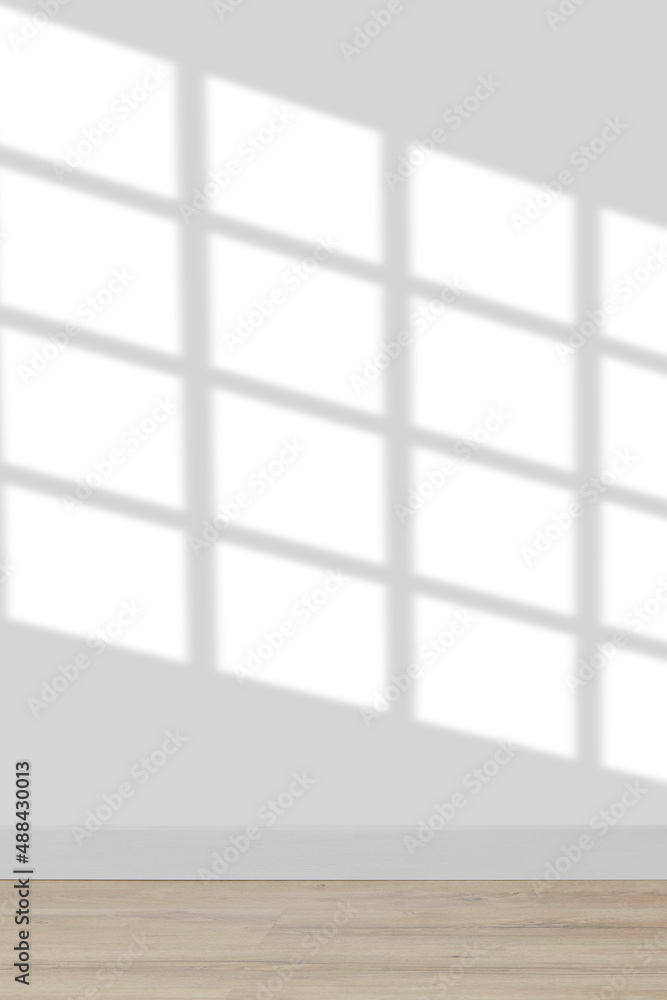 Background with empty white wall with wooden floor with window shadow with big space for advertisement or text. Background with empty white wall with wooden floor with window shadow with big space for advertisement or text.