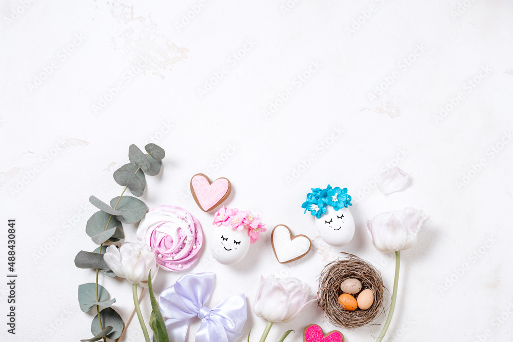 Stylish eggs with flowers and sweets for Easter. Beautiful banner with space for text for Easter day. Concept of a greeting card flatlay