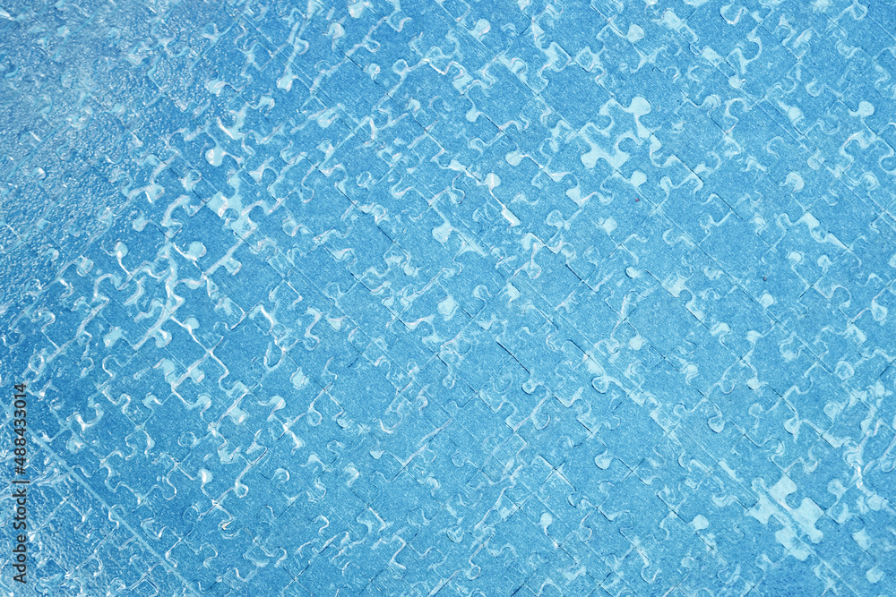 Jigsaw puzzle. Close-up of blank blue puzzle texture background Jigsaw puzzle. Close-up of blank blue puzzle texture background