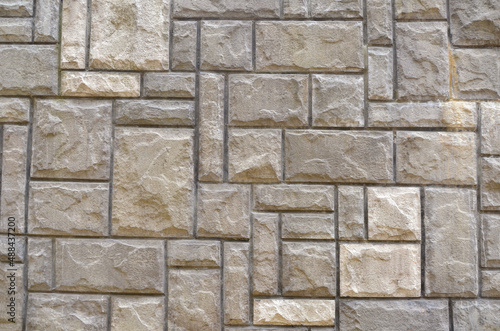 Wallpaper Mural Textured background from decorative stones in grey- beige tones. Seamless wall pattern from stones. Close up photo. Torontodigital.ca