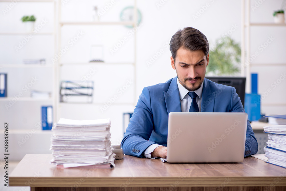 Young businessman employee working in the office Young businessman employee working in the office