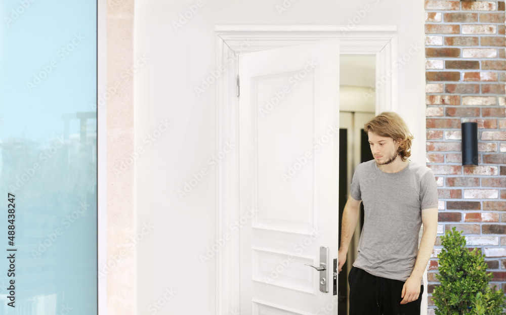 man opening the door of his home. man opening the door of his home.