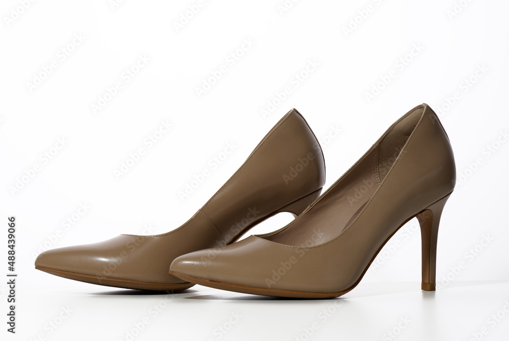 leather beige high heel shoes on a white background leather beige high heel shoes on a white background