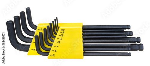 Black Allen key set of blued steel in yellow tool box isolated on a white background. Close-up of metal various sized hex L wrenches kit with oxide coating, ball ends and inch scale in plastic holder. photo