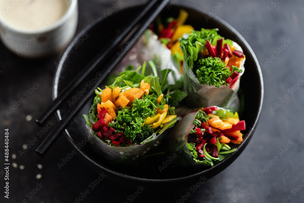 Rice paper roll with vegetables on plate Rice paper roll with vegetables on plate