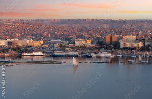Panorama of Aswan city along Nile river with felucca boats in Egypt, Africa
