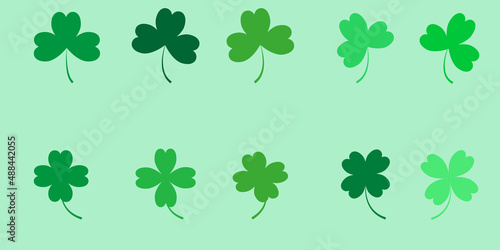 Set of clovers of different shades of green, 3 and 4 leaf clovers	
