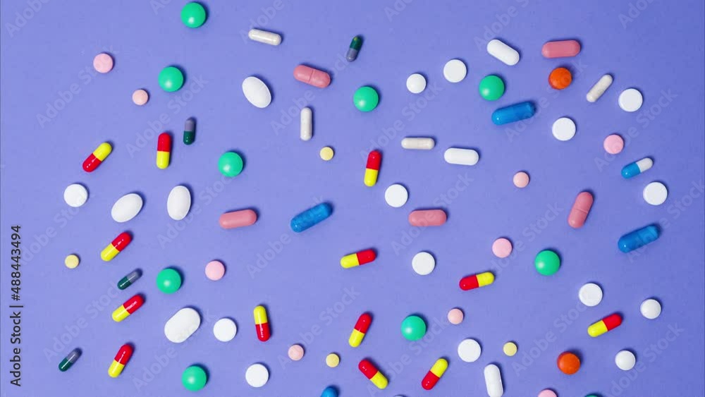 Background with moving pills. Stop motion 4K resolution medical video Background with moving pills. Stop motion 4K resolution medical video