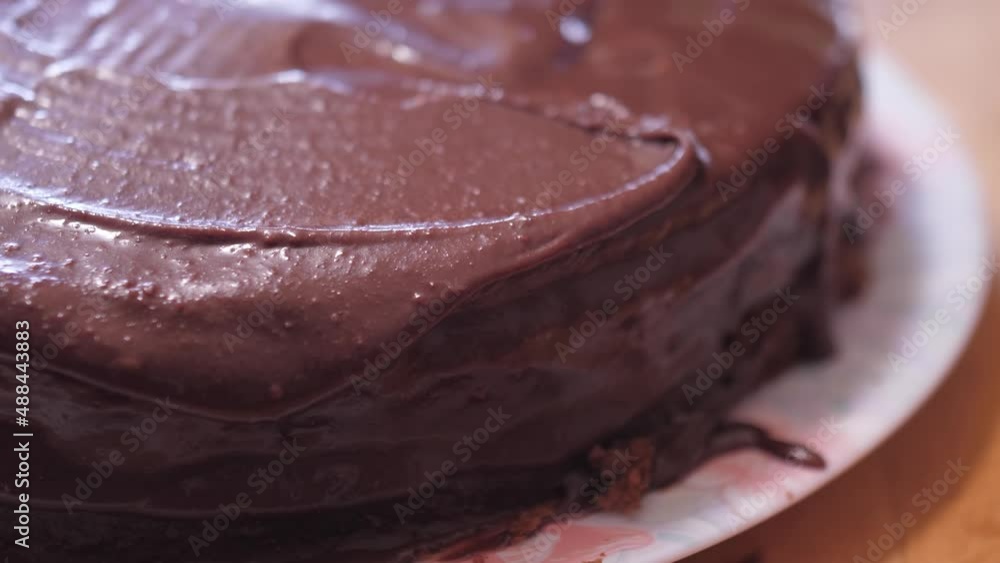 spreading chocolate on cake slow motion 4k spreading chocolate on cake slow motion 4k
