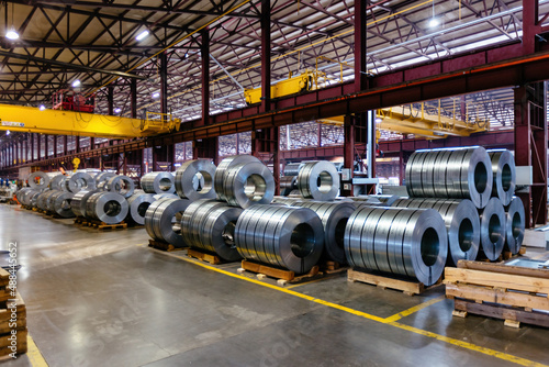 Rolls of galvanized steel sheet inside the factory or warehouse photo