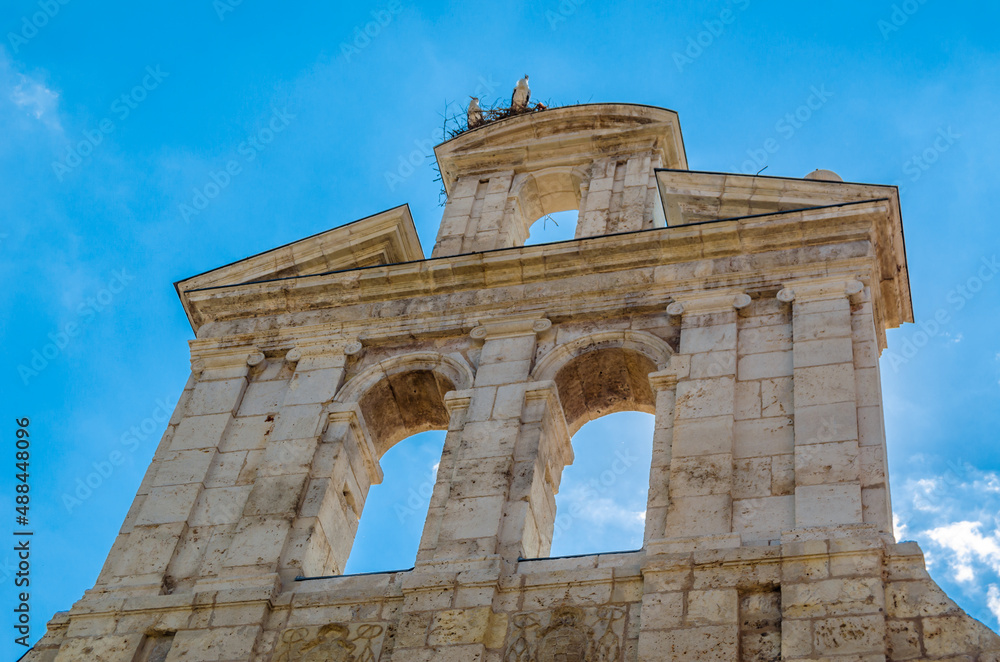 Church in Alcala de Henares with storks on the tower, Madrid province, Spain Church in Alcala de Henares with storks on the tower, Madrid province, Spain