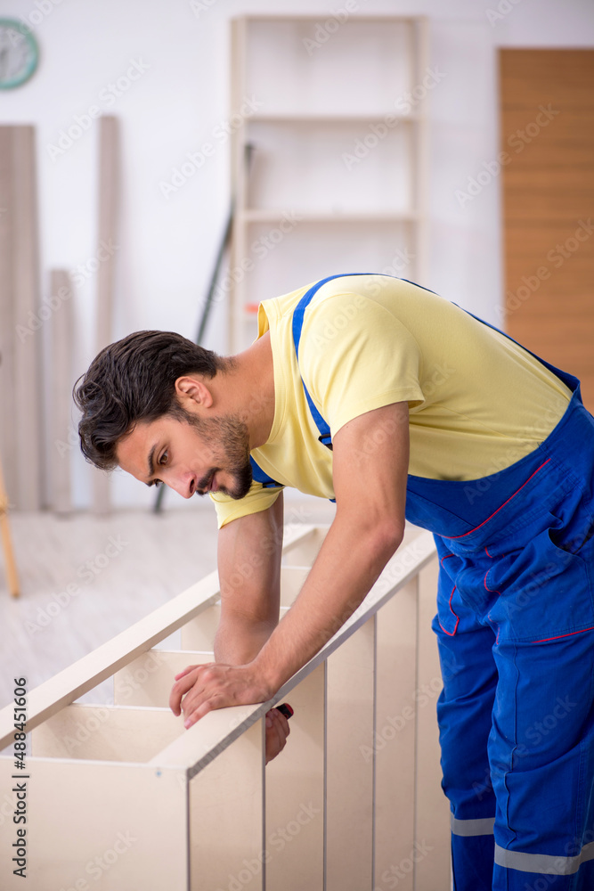 Young male carpenter working at home Young male carpenter working at home