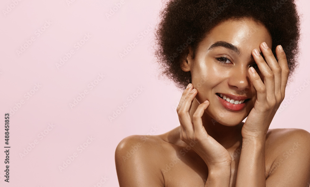 Skin care. African american woman with beauty face touching healthy