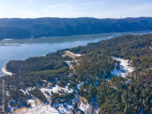 Aerial winter view of Dospat Reservoir covered with ice  Bulgaria