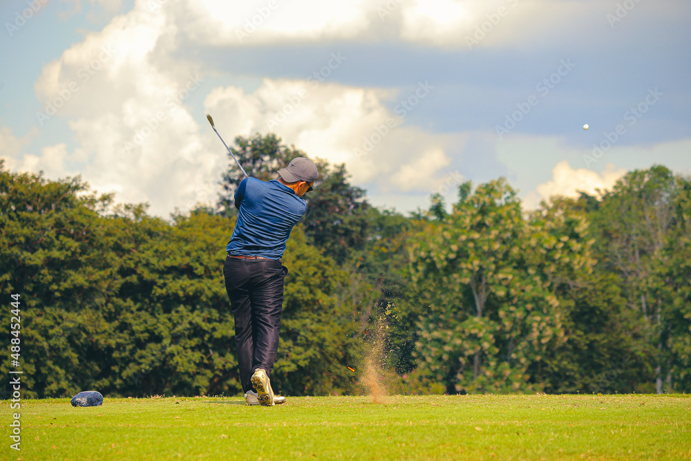 Man Playing Golf on Beautiful Day Green Golf Course. Man Playing Golf on Beautiful Day Green Golf Course.