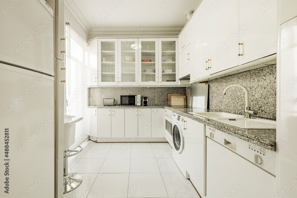 Picture of Kitchen with white cabinets and appliances, granite top and wall and ...