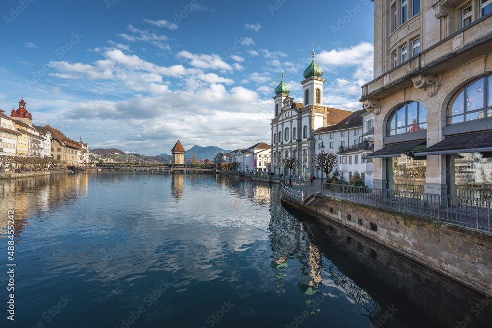 Naklejka premium Reuss River with Jesuit Church and Chapel Bridge (Kapellbrucke) - Lucerne, Switzerland