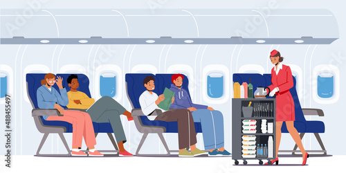 Airplane Crew and Passengers in Plane. Stewardess with Trolley Serving People Sitting on Chairs in Economy Class