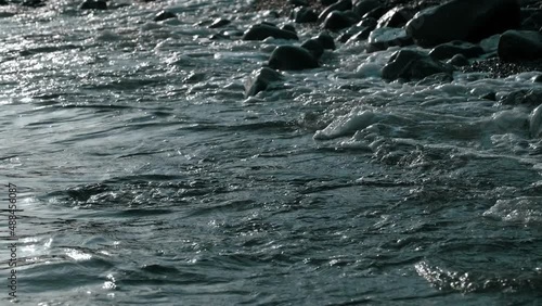 Wallpaper Mural dramatic waves of sea splashing against the rocks on beach in evening slow motion Torontodigital.ca