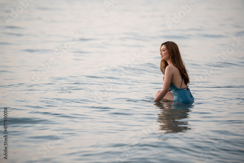 happy woman in swimsuit on sea beach at Koh Chang island  Thailand