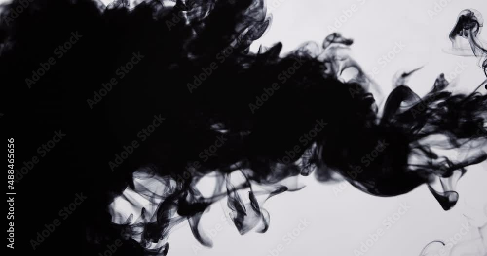 Injection of black ink on a white isolated background. Injection of black ink on a white isolated background.