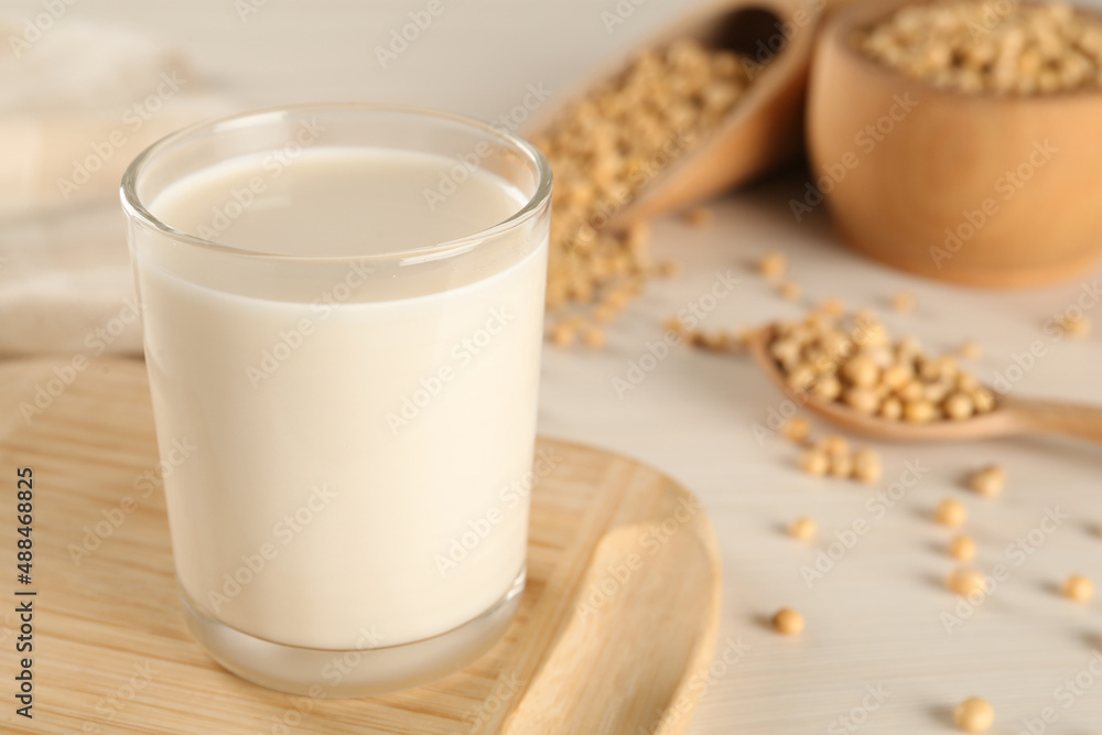 Fresh soy milk and beans on table, closeup. Space for text Fresh soy milk and beans on table, closeup. Space for text