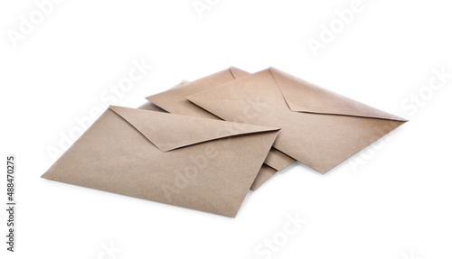 Heap of brown paper envelopes on white background