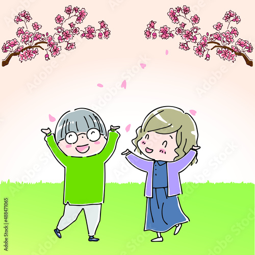 桜を見上げて喜ぶ女性たち