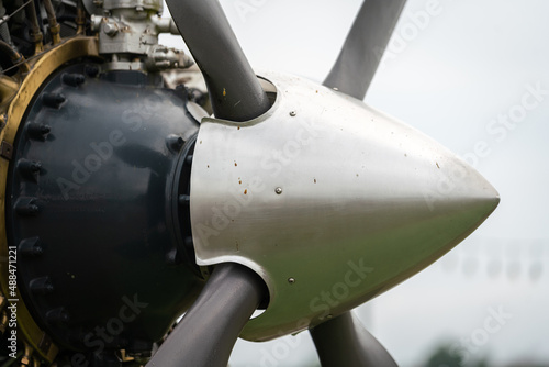 Fotografie Close-up at historical WWII fighter airplane's propeller cap nose, front of the plane part