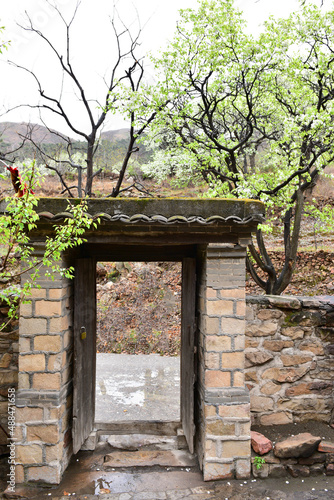 In spring, the mountain village with pear flowers in full bloom