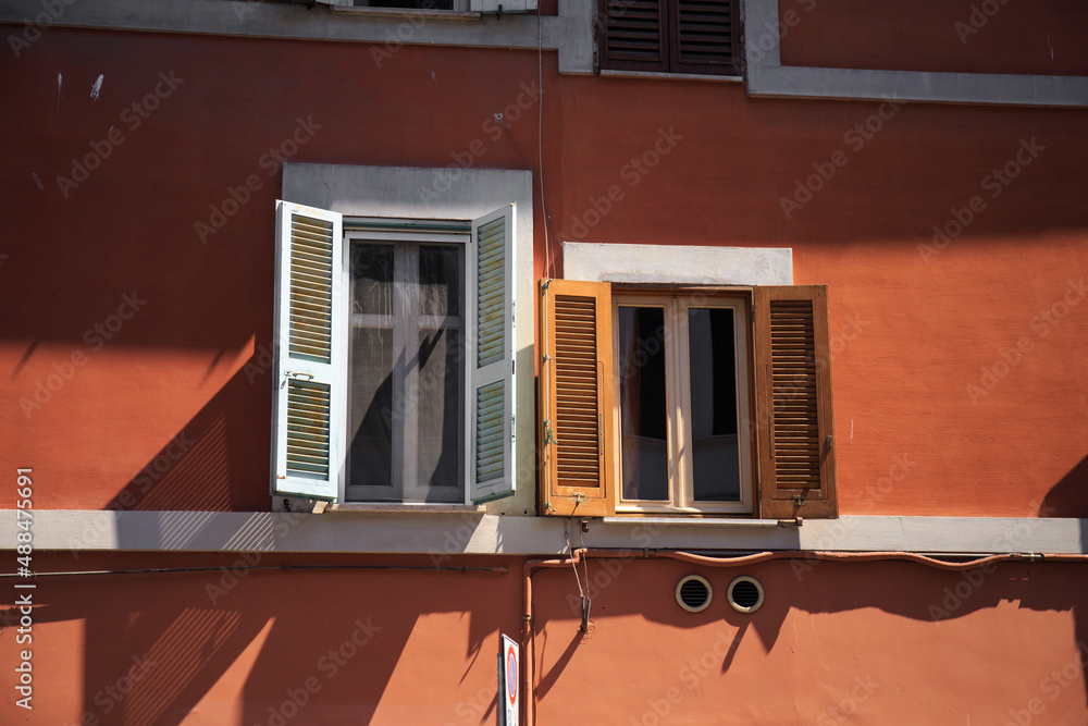 Small and big windows with shutters