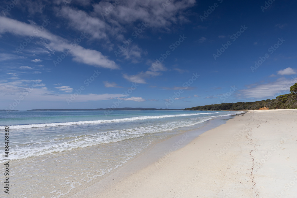 View along the white sand of Nelsons beach near Jervis Bay in NSW, Australia