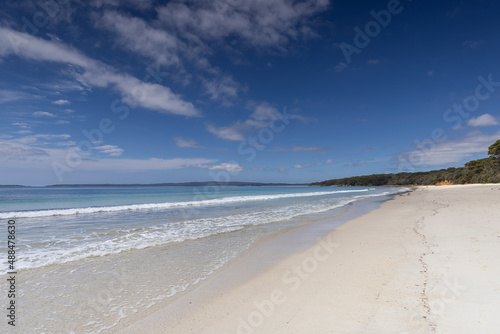 View along the white sand of Nelsons beach near Jervis Bay in NSW  Australia