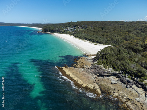Aerial view of the beautiful Chinamans (in distance) and Greenfield beach in NSW, Australia, a popular white sand swimming beach