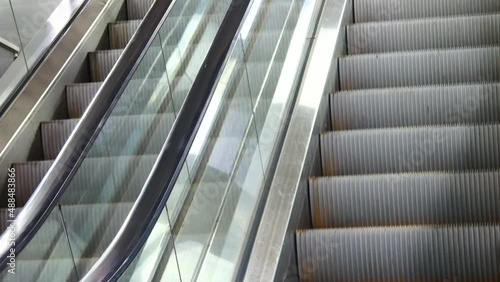 Close-up of two old escalator tracks moving reversibly photo