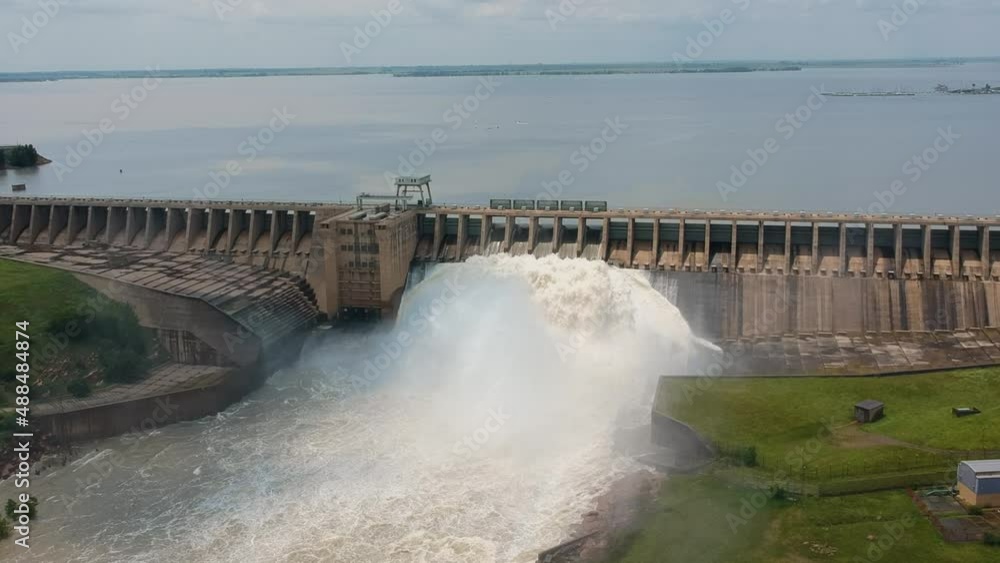High angle of long dam wall with 64 sluice gates. High angle of long dam wall with 64 sluice gates.