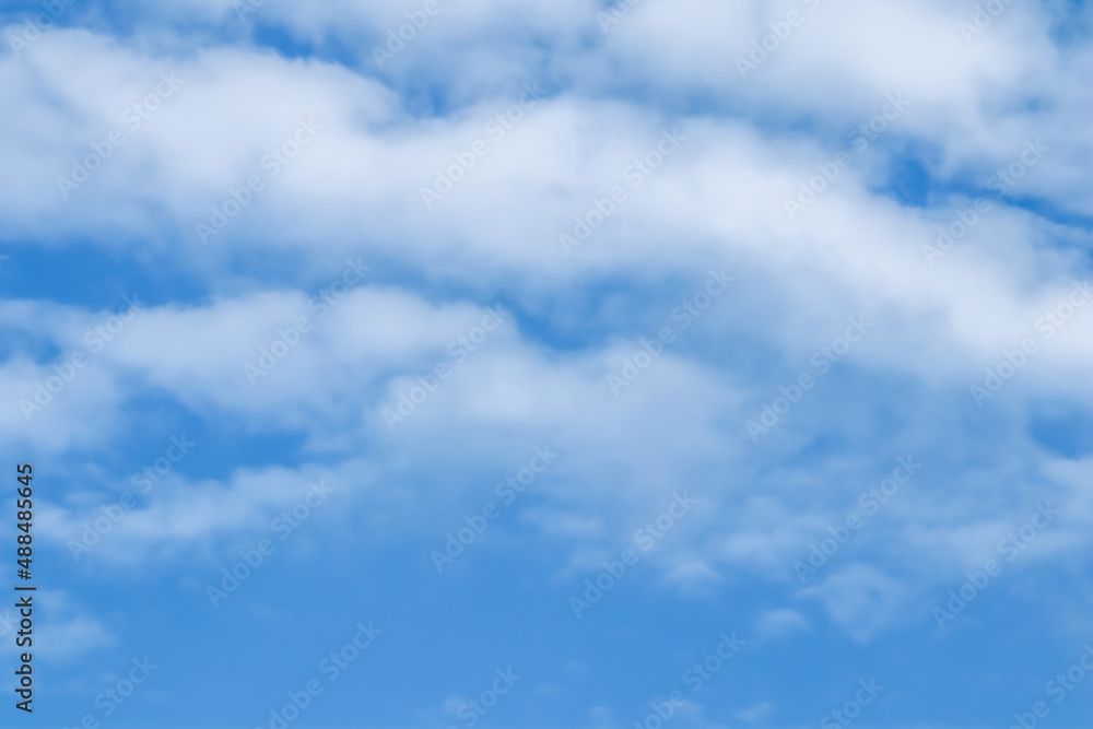 Fototapeta premium Background of blue sky with white clouds