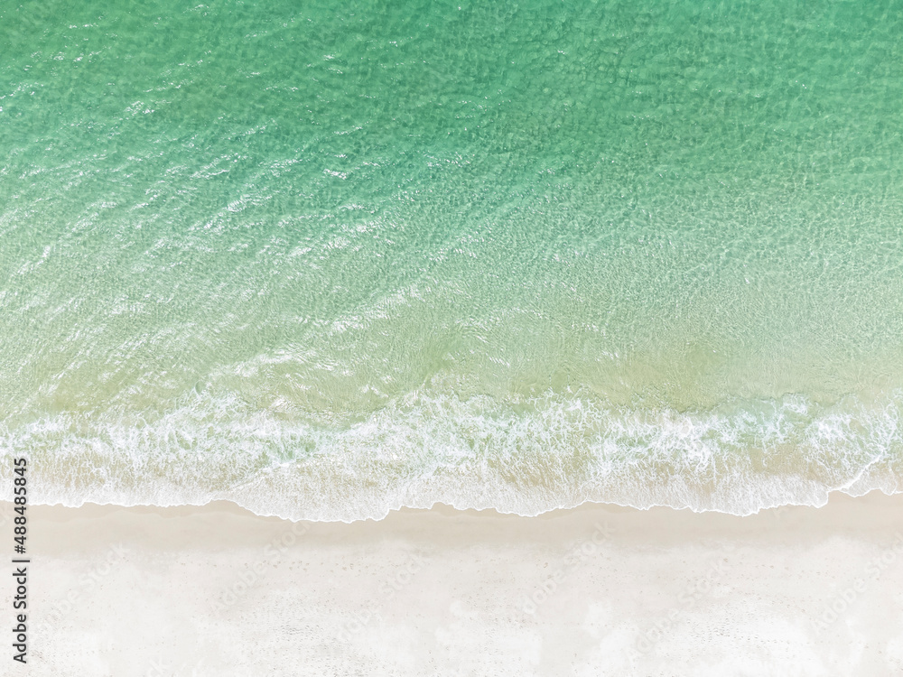 Overhead view of the white sand and surf at .Chinamans beach in NSW, Australia