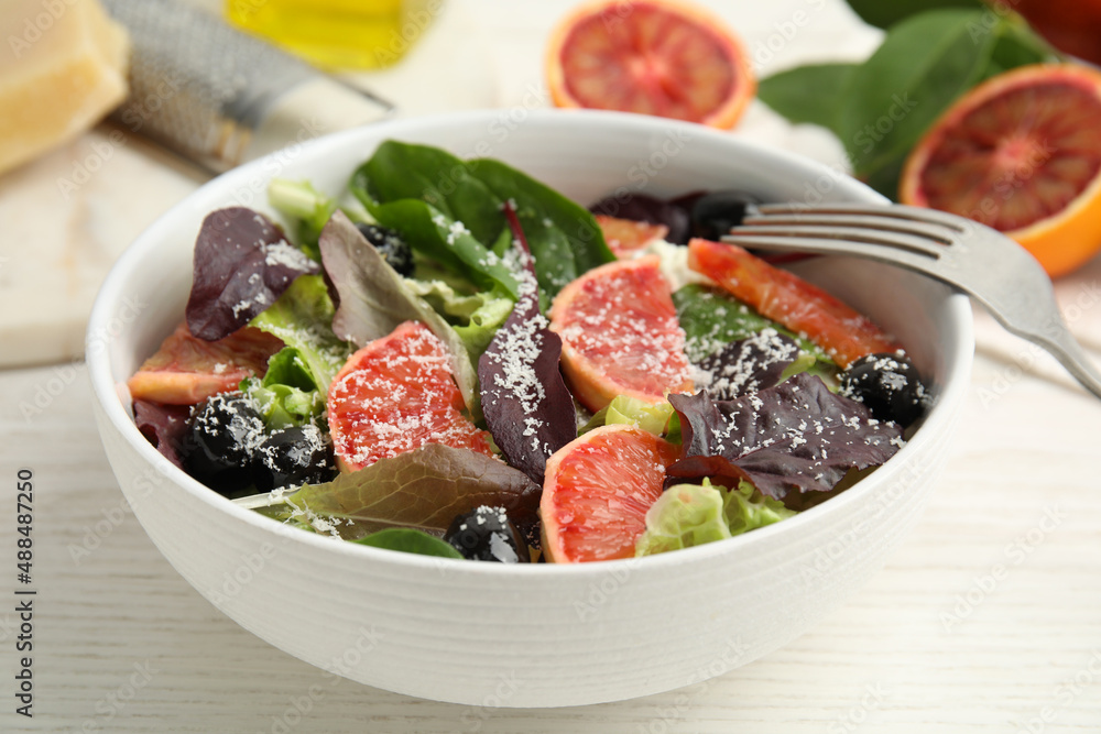 Bowl of delicious sicilian orange salad on white wooden table, closeup Bowl of delicious sicilian orange salad on white wooden table, closeup