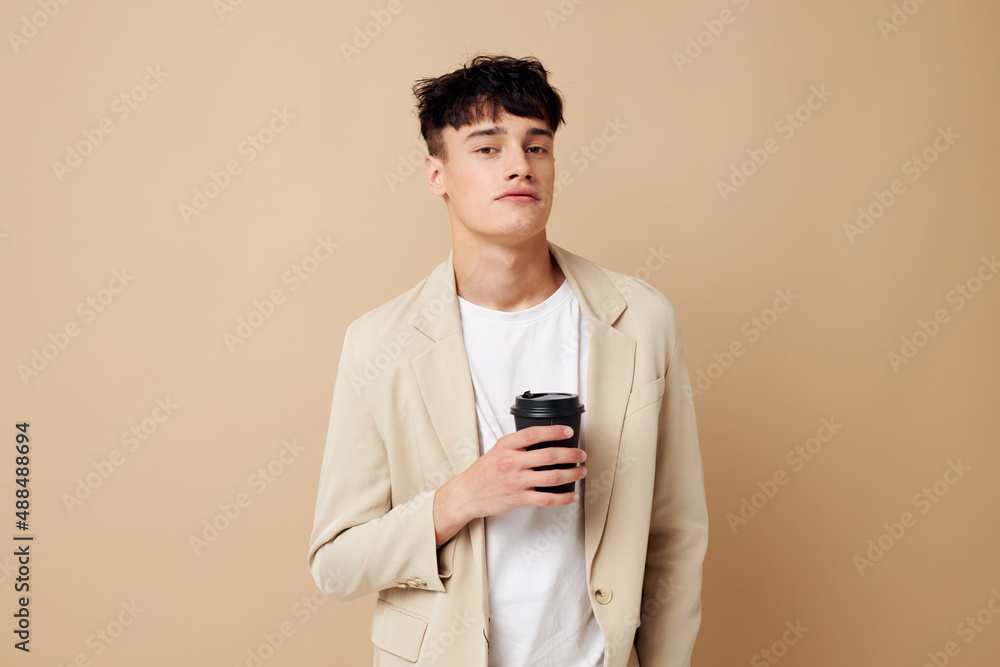 Man a man in a light jacket a glass with a drink Lifestyle unaltered Man a man in a light jacket a glass with a drink Lifestyle unaltered