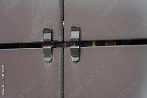 Fotografie black square ventilated ceramic panels installed on the facade of the building