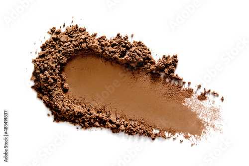 Face makeup powder texture. Brown eye shadow bronzer swatch smudge isolated on white. Make up product smear closeup. photo