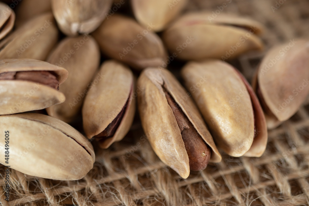 shelled pine nuts on a straw mat. close-up. shelled pine nuts on a straw mat. close-up.