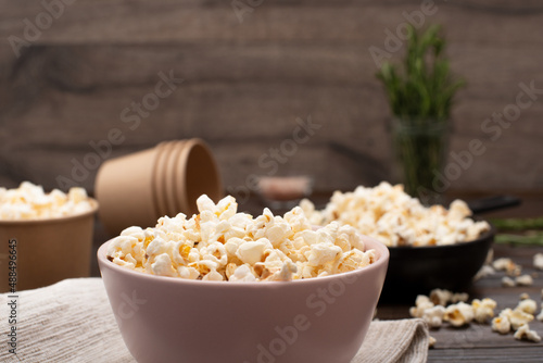 Wallpaper Mural Bowl with popped corns on kitchen table with rosemary on background Torontodigital.ca