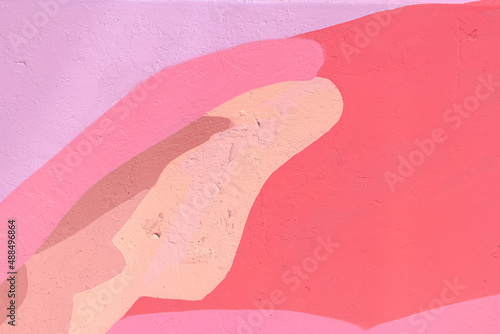 Fototapeta Closeup of colorful pink, beige, coral urban wall texture