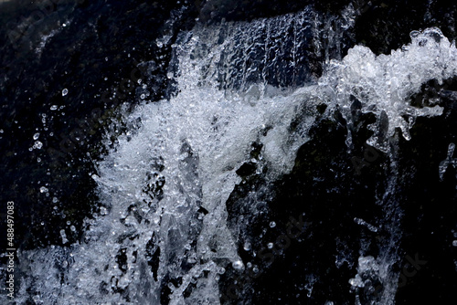 rapid and turbulent streams of water in a rocky mountain river