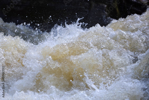 rapid and turbulent streams of water in a rocky mountain river