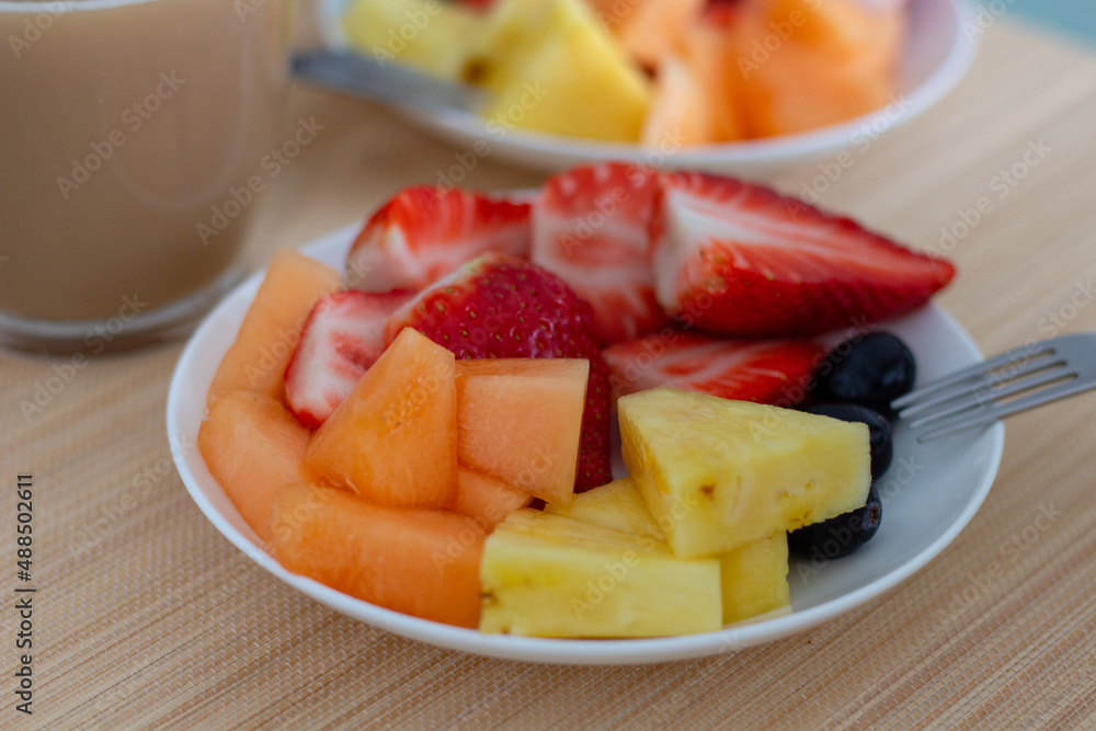 Colorful, ripe, delicious fruits on table and Coffee, breakfast, morning Colorful, ripe, delicious fruits on table and Coffee, breakfast, morning