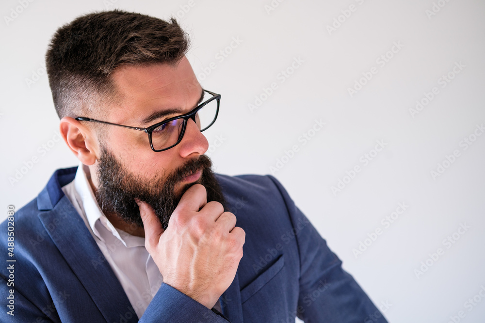 Portrait of businessman who is thoughtful and worried. Copy space on image for your text or advert. Portrait of businessman who is thoughtful and worried. Copy space on image for your text or advert.